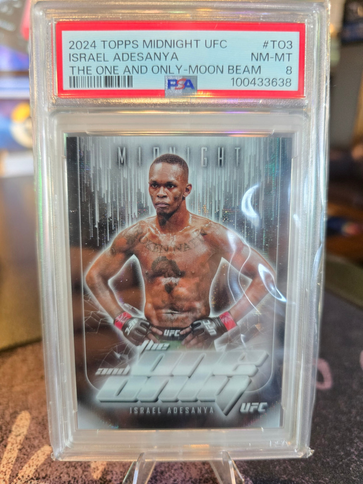 Topps Midnight UFC 2024 - Israel Adesanya - The One and Only (/49) Moonbeam PSA 8