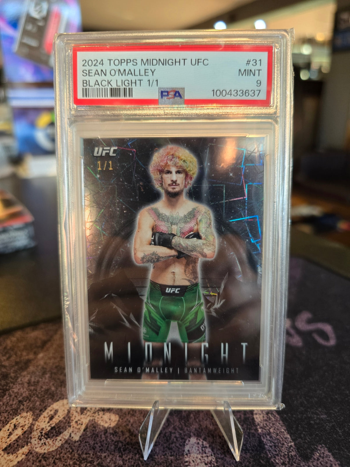(Listed on Ebay) Topps Midnight UFC 2024 - Sean O'Malley - 1/1 Black Light - PSA 9