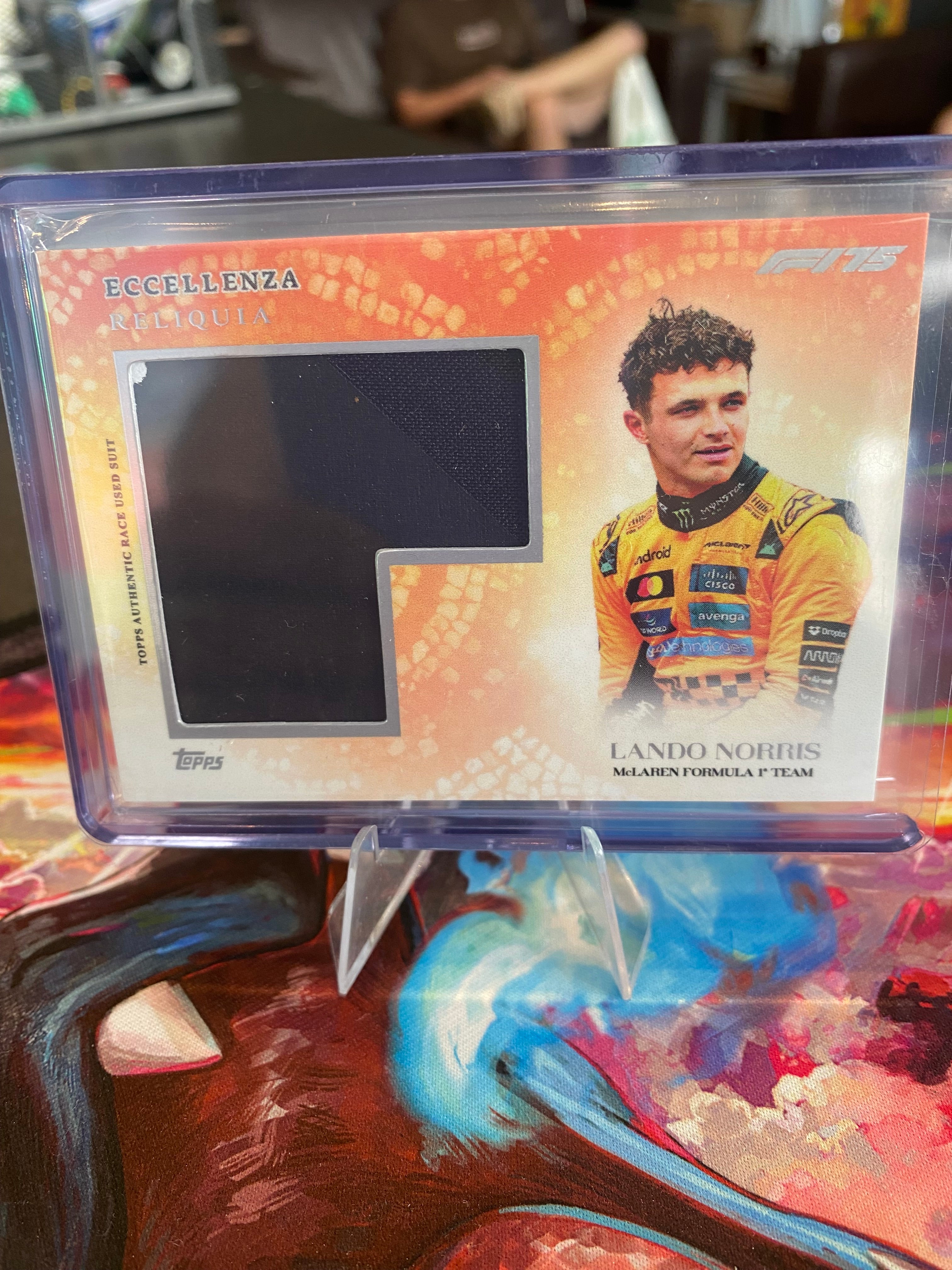 Topps Eccellenza 2025 - Lando Norris -Race Suit Relic - Reliquia